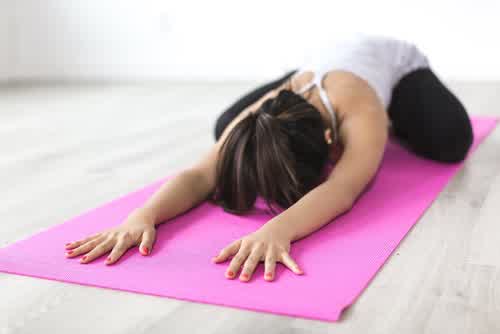 Woman stretching as part of a women's health genetic insight and hormonal wellness routine